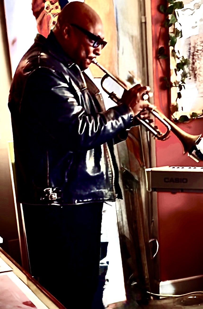 Willis Wilson playing trumpet at a live performance