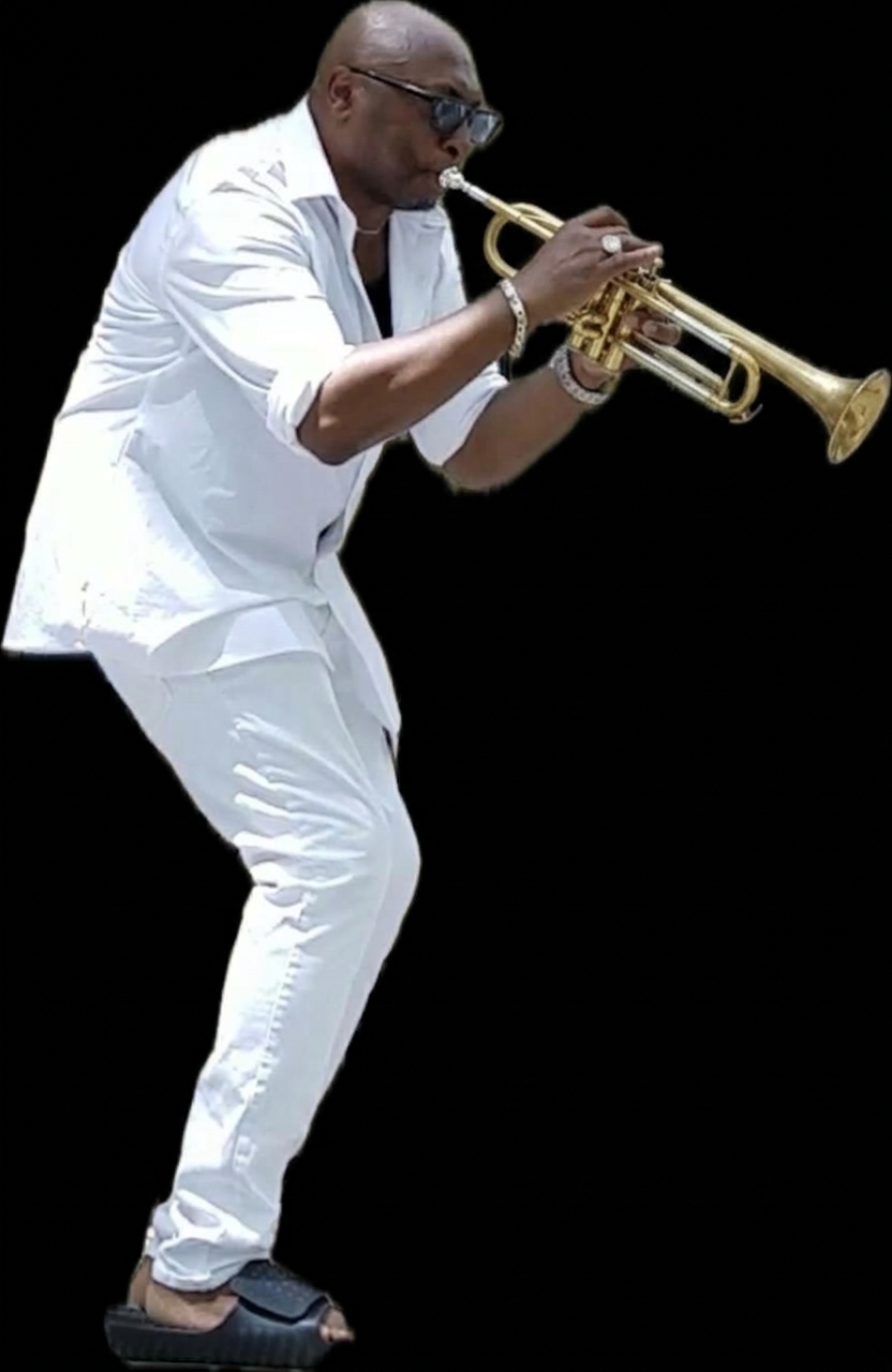 Willis Wilson playing trumpet in white