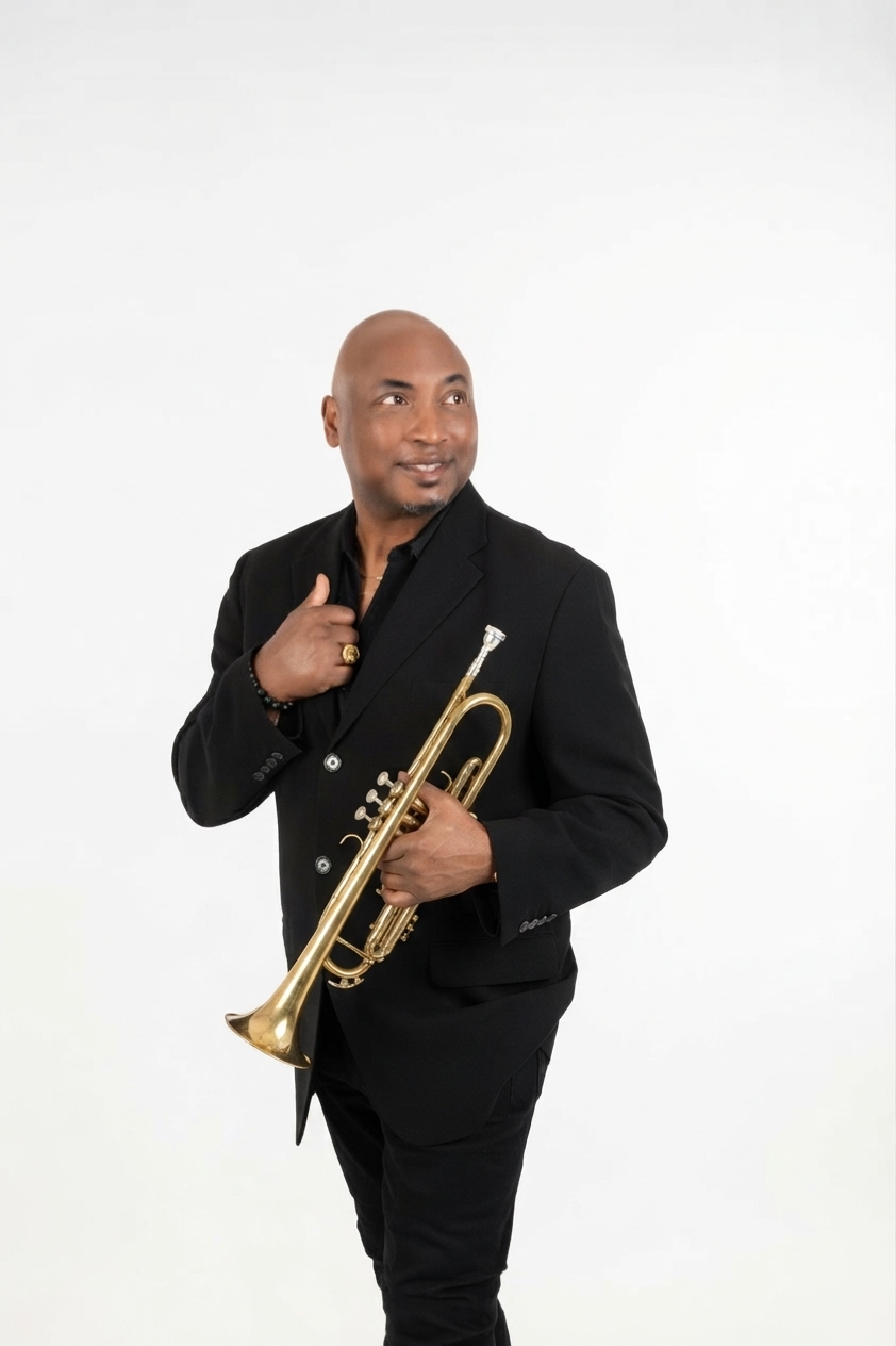 Willis Wilson in a black suit holding his trumpet